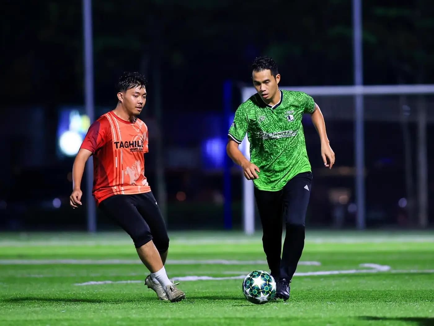 Two opponents pushing for the ball at ArmourX Sports