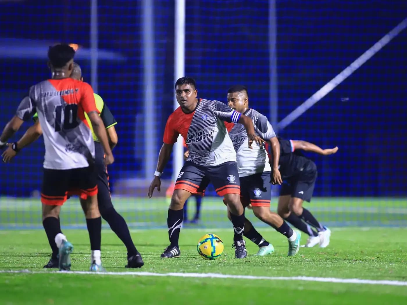 Players passing the ball between them at ArmourX Sports