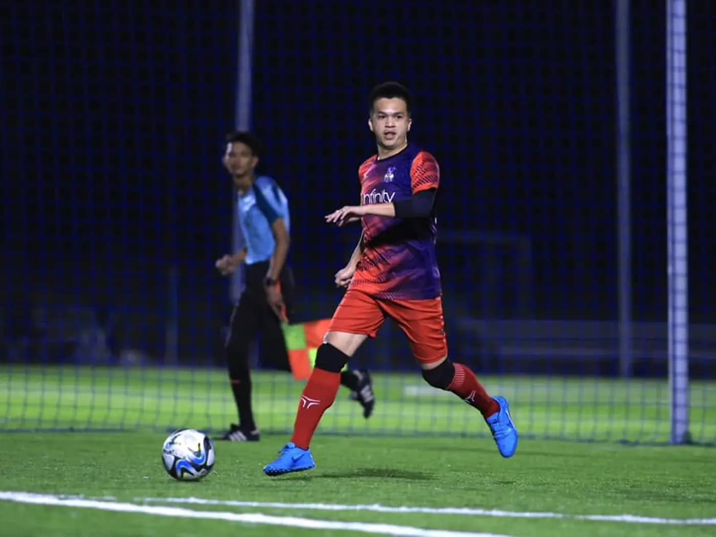A player in full flow with the ball at ArmourX Sports