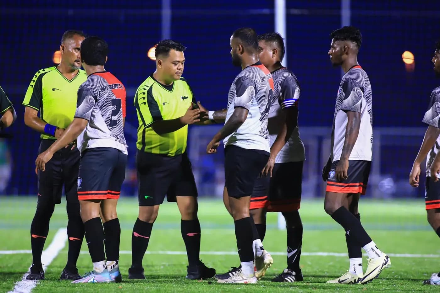 Teams and a referee in the middle of a match at the ArmourX Sports venue